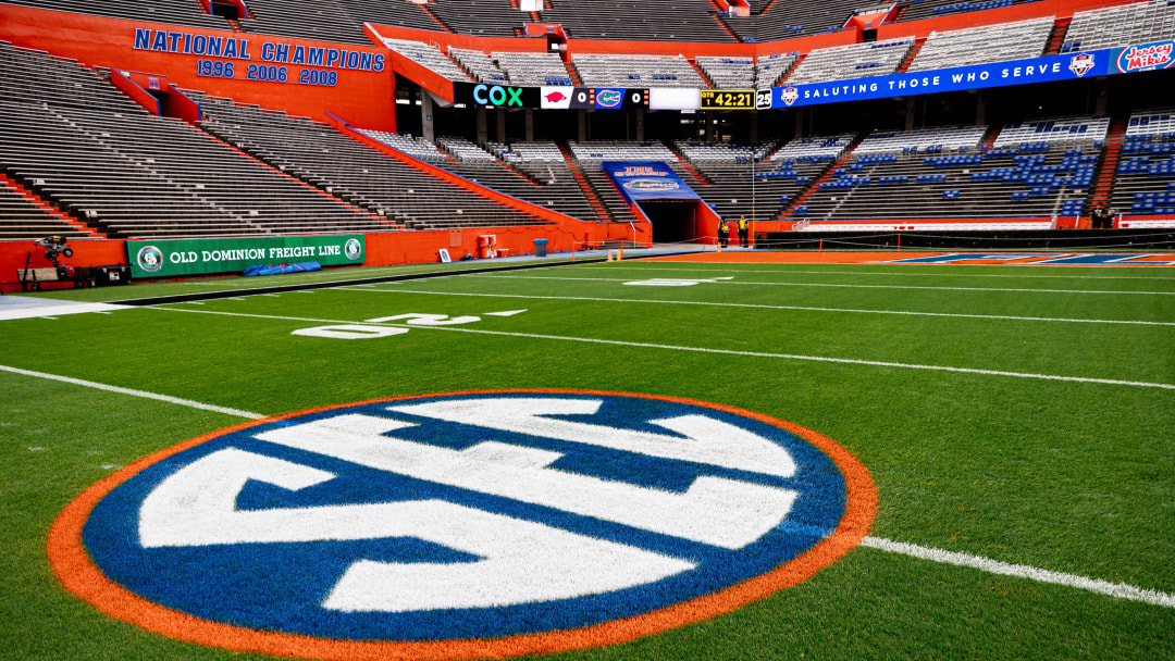 The SEC logo in orange and blue colors is painted on the field before the game between the Florida Gators and Arkansas Razorbacks at Steve Spurrier Field at Ben Hill Griffin Stadium in Gainesville, FL on Saturday, November 4, 2023. [Matt Pendleton/Gainesville Sun]