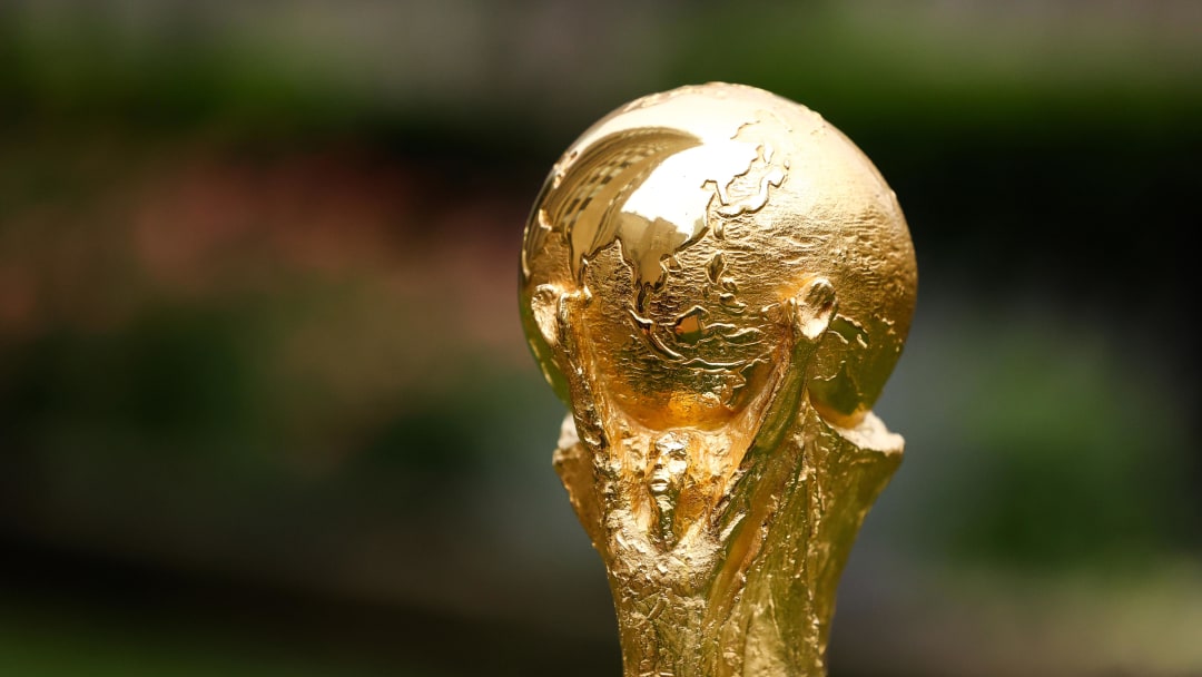 Jun 16, 2022; New York, New York, USA; A detail view of The FIFA World Cup Trophy sits on a stand outside of 30 Rockefeller Plaza.  Mandatory Credit: Jessica Alcheh-USA TODAY Sports