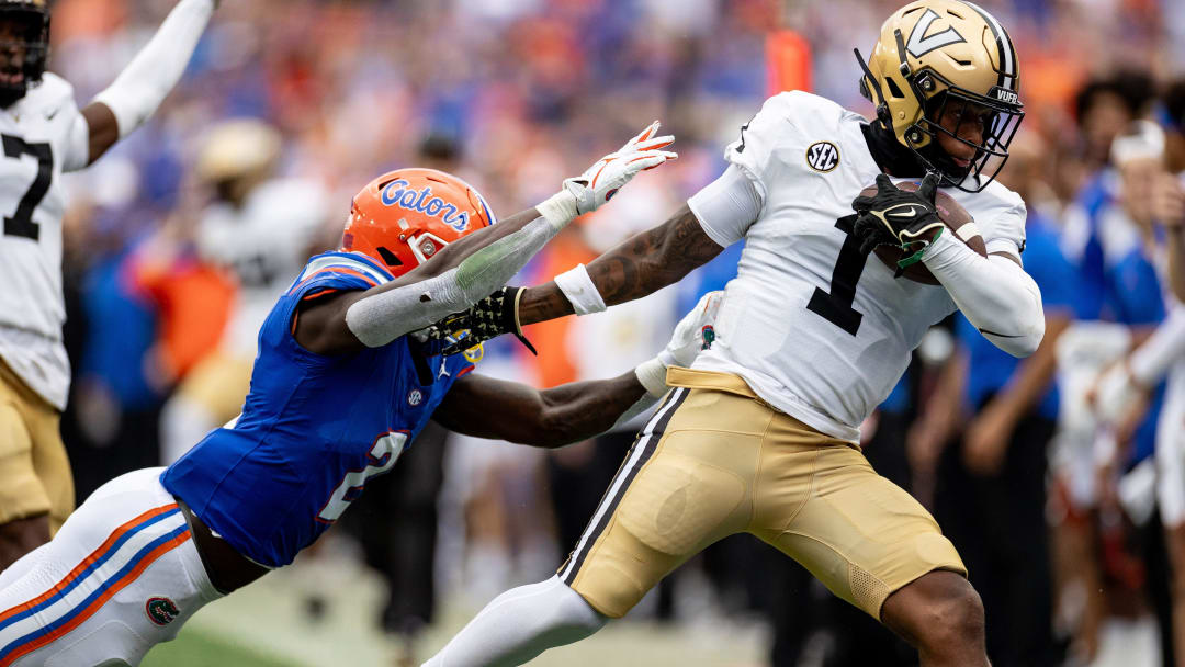 Florida Gators running back Montrell Johnson Jr. (2) tackles Vanderbilt Commodores linebacker CJ Taylor (1) after an interception during the first half at Steve Spurrier Field at Ben Hill Griffin Stadium in Gainesville, FL on Saturday, October 7, 2023. [Matt Pendleton/Gainesville Sun]