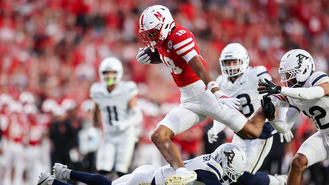Nebraska wide receiver Quinn Clark avoids Akron defenders on the way to a 37-yard touchdown.