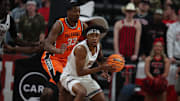 Jan 26, 2025; Lubbock, Texas, USA;  Texas Tech Red Raiders forward JT Toppin (15) looks for room against Oklahoma State Cowboys forward Abou Ousmane (33) in the first half at United Supermarkets Arena. Mandatory Credit: Michael C. Johnson-Imagn Images