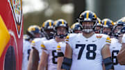 Jan 1, 2024; Orlando, FL, USA; Iowa Hawkeyes offensive lineman Mason Richman (78) leads the defense out of the tunnel for warm-ups before the game against the Tennessee Volunteers at Camping World Stadium. Mandatory Credit: Morgan Tencza-Imagn Images
