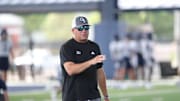Georgia Southern Coach Clay Helton talks to a player during the first practice of the season on Wednesday, July 31, 2024 at the Tippins Family Training Facility in Statesboro.