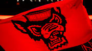 Nov 22, 2024; Raleigh, North Carolina, USA;  North Carolina State Wolfpack flag prior to the first half of the game against the William & Mary Tribe at Lenovo Center. Mandatory Credit: Jaylynn Nash-Imagn Images