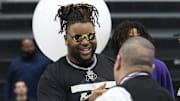 Lipscomb Academy offensive lineman Chauncey Gooden greets well-wishers before the start of the school's high school football signing ceremony during the early signing period Wednesday, Dec. 4, 2024 at Lipscomb Academy in Nashville, Tennessee.
