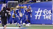Nov 9, 2024; Winnipeg, Manitoba, CAN;  Winnipeg Blue Bombers wide receiver Kenny Lawler (89) celebrates his touchdown with teammates during the first half of the game between the Winnipeg Blue Bombers and the Saskatchewan Roughriders at Princess Auto Stadium. Mandatory Credit: Bruce Fedyck-Imagn Images