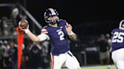 Nashville Christian quarterback Jared Curtis (2) drops his arm angle down to make a pass around Fayetteville defenders during the first quarter of their TSSAA football game Friday, Oct. 18, 2024 at Nashville Christian School in Nashville, Tennessee.