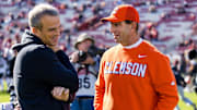Nov 29, 2025; Columbia, South Carolina, USA; 
Clemson Tigers head coach Dabo Swinney and South Carolina Gamecocks head coach Shane Beamer chat before their game at Williams-Brice Stadium. Mandatory Credit: Jeff Blake-Imagn Images