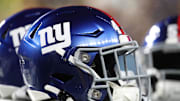 Oct 28, 2024; Pittsburgh, Pennsylvania, USA;  New York Giants helmets on the sidelines against the Pittsburgh Steelers during the third quarter at Acrisure Stadium. Mandatory Credit: Charles LeClaire-Imagn Images