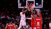 Nov 12, 2025; Houston, Texas, USA; Houston Rockets guard Amen Thompson (1) dunks against Washington Wizards center Alex Sarr (20) during the third quarter at Toyota Center. Mandatory Credit: Erik Williams-Imagn Images