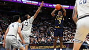 Nov 16, 2024; Washington, District of Columbia, USA; Notre Dame Fighting Irish guard Markus Burton (3) takes a shot over Georgetown Hoyas forward Jordan Burks (23) during the second half at Capital One Arena. 