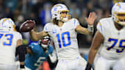 Los Angeles Chargers quarterback Justin Herbert (10) looks to pass during the third quarter of an NFL first round playoff football matchup Saturday, Jan. 14, 2023 at TIAA Bank Field in Jacksonville, Fla. Jacksonville Jaguars edged the Los Angeles Chargers on a field goal 31-30. [Corey Perrine/Florida Times-Union]

Jki 011423 Chargers Jags C 46