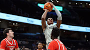 Nov 9, 2024; Washington, District of Columbia, USA; Georgetown Hoyas forward Thomas Sorber (35) takes a shot over Fairfield Stags guard Michael Rogan (25) and Fairfield Stags forward Birima Seck (1) during the first half at Capital One Arena. Mandatory Credit: Daniel Kucin Jr.-Imagn Images


