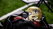 Nov 5, 2023; New Orleans, Louisiana, USA;  Detailed view of the New Orleans Saints helmet and ball bag against the Chicago Bears during the first half at the Caesars Superdome. Mandatory Credit: Stephen Lew-Imagn Images