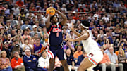 Feb 26, 2025; Auburn, Alabama, USA;  Mississippi Rebels forward Malik Dia (0) takes a shot over Auburn Tigers center Dylan Cardwell (44) during the first half at Neville Arena. Mandatory Credit: John Reed-Imagn Images