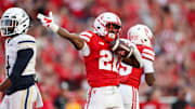 Nebraska running back Emmett Johnson signals after a 36-yard run against Akron.