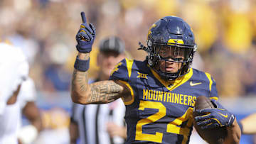 Sep 13, 2025; Morgantown, West Virginia, USA; West Virginia Mountaineers wide receiver Rodney Gallagher III (24) celebrates a first down after a catch during the first quarter against the Pittsburgh Panthers at Milan Puskar Stadium. Mandatory Credit: Ben Queen-Imagn Images