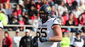 Nov 30, 2024; Lubbock, Texas, USA;  West Virginia Mountaineers offensive lineman Justin Terry (65) in the second half during the game against the Texas Tech Red Raiders at Jones AT&T Stadium and Cody Campbell Field. Mandatory Credit: Michael C. Johnson-Imagn Images