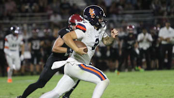 Nashville Christian quarterback Jared Curtis (2) sprints down field against Davidson Academy in a TSSAA football season-opening 56-28 win on Aug. 22, 2025 at Davidson Academy in Nashville, Tennessee.