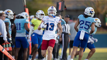 Kansas redshirt freshman wide receiver Keaton Kubecka (13) runs out of bounds on a play during Friday's Spring Preview at Rock Chalk Park.
