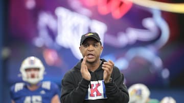 Kansas co-defensive coordinator and cornerbacks coach D.K. McDonald works with players during a team practice Tuesday, April 2, 2024, inside the Indoor Football Practice Facility.