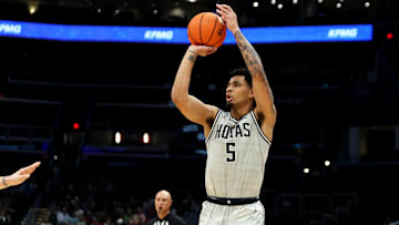 Nov 30, 2024; Washington, District of Columbia, USA; Georgetown Hoyas guard Micah Peavy (5) shoots the ball against the Albany Great Danes during the first half at Capital One Arena. Mandatory Credit: Daniel Kucin Jr.-Imagn Images