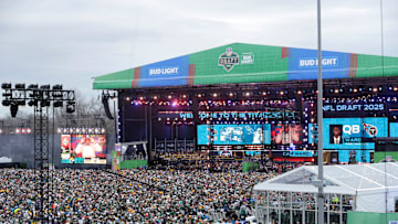 Fans look on as Cam Ward is announced as the first pick during the first day of the NFL Draft presented by Bud Light at the Draft Theater Thursday, April 24, 2025, outside of Lambeau Field in Green Bay, Wisconsin.