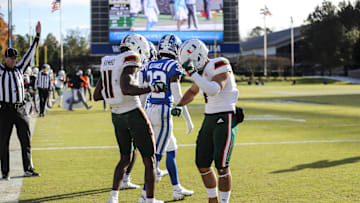 Nov 27, 2021; Durham, North Carolina, USA;  Miami Hurricanes wide receiver Charleston Rambo (11) and Miami Hurricanes wide receiver Xavier Restrepo (7) celebrate a touchdown during the second half of the game against the Miami Hurricanes at Wallace Wade Stadium. at Wallace Wade Stadium. Mandatory Credit: Jaylynn Nash-Imagn Images