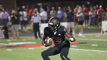 Ravenwood's Femi Babalola makes a move to make an Alcoa defender miss in the fourth quarter of their game Friday, August 18, 2023 at Ravenwood High School in Brentwood, Tennessee.