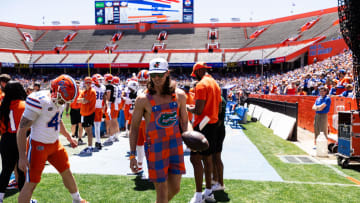 Former Florida Gators punter Tommy Townsend warms up with Florida Gators kicker Hunter Smith (41) during the first half at the Orange and Blue spring football game at Steve Spurrier Field at Ben Hill Griffin Stadium in Gainesville, FL on Saturday, April 13, 2024. [Matt Pendleton/Gainesville Sun]