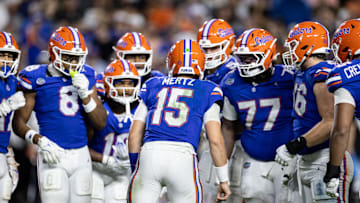 Oct 5, 2024; Gainesville, Florida, USA; Florida Gators quarterback Graham Mertz (15) calls a play in the huddle against the UCF Knights during the second half at Ben Hill Griffin Stadium. Mandatory Credit: Matt Pendleton-Imagn Images