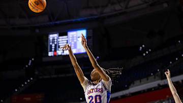Florida Gators guard Jeriah Warren (20) attempts a three-point shot against the St. John's Red Storm during the second half at Billy Donovan Court at Stephen C. O'Connell Center in Gainesville, FL on Thursday, March 21, 2024. [Matt Pendleton/Gainesville Sun]