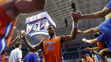 Feb 4, 2025; Gainesville, Florida, USA; Florida Gators guard Alijah Martin (15) high fives fans after the game against Vanderbilt Commodores at Exactech Arena at the Stephen C. O'Connell Center. Mandatory Credit: Morgan Tencza-Imagn Images