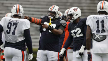 Apr 8, 2023; Auburn, AL, USA;  Auburn Tigers offensive lineman Jeremiah Wright (77) talks with lineman Dillon Wade (52) during the annual Auburn Spring Game at Jordan-Hare Stadium. Mandatory Credit: John Reed-USA TODAY Sports