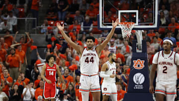 Feb 22, 2025; Auburn, Alabama, USA; Auburn Tigers center Dylan Cardwell (44) tries to get the crowd involved against the Georgia Bulldogs during the second half at Neville Arena.  Mandatory Credit: John Reed-Imagn Images