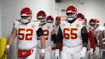 Dec 25, 2024; Pittsburgh, Pennsylvania, USA;  Kansas City Chiefs center Creed Humphrey (52) and guard Trey Smith (65) walk to the field to warm up against the Pittsburgh Steelers at Acrisure Stadium. Mandatory Credit: Charles LeClaire-Imagn Images