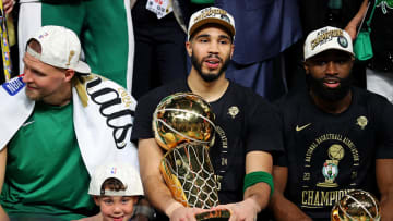 Jun 17, 2024; Boston, Massachusetts, USA; Boston Celtics forward Jayson Tatum (0) and guard Jaylen Brown (7) celebrates with the Larry O’Brian Trophy after beating the Dallas Mavericks in game five of the 2024 NBA Finals to win the NBA Championship at TD Garden. Mandatory Credit: Peter Casey-USA TODAY Sports