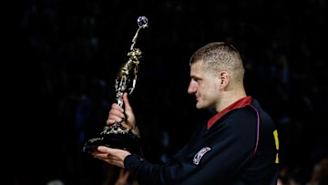 May 14, 2024; Denver, Colorado, USA; Denver Nuggets center Nikola Jokic (15) gestures with the KIA NBA MVP trophy to his teammates before game five against the Minnesota Timberwolves in the second round for the 2024 NBA playoffs at Ball Arena. Mandatory Credit: Isaiah J. Downing-Imagn Images