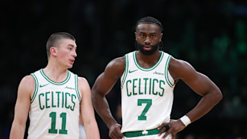 Dec 7, 2024; Boston, Massachusetts, USA; Boston Celtics forward Jaylen Brown (7) and Boston Celtics guard Payton Pritchard (11) talk during the first half against the Memphis Grizzlies at TD Garden. Mandatory Credit: Paul Rutherford-Imagn Images