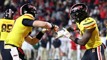 Nov 16, 2024; College Park, Maryland, USA; Maryland Terrapins quarterback Billy Edwards Jr. (9) and running back Roman Hemby (24) celebrate after a score against the Rutgers Scarlet Knights during the second half at SECU Stadium. Mandatory Credit: Daniel Kucin Jr.-Imagn Images