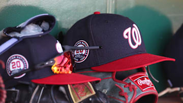Apr 17, 2025; Pittsburgh, Pennsylvania, USA; Washington Nationals hats and gloves in the dugout against the Pittsburgh Pirates during the sixth inning at PNC Park. Mandatory Credit: Charles LeClaire-Imagn Images