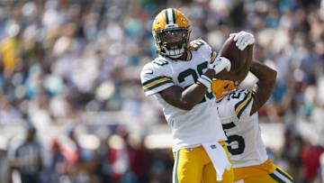 Green Bay Packers safety Xavier McKinney (29) and cornerback Keisean Nixon (25) celebrate an interception at Jacksonville.