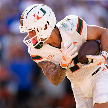 Aug 31, 2024; Gainesville, Florida, USA; Miami Hurricanes wide receiver Xavier Restrepo (7) catches a pass and runs for a touchdown against the Florida Gators during the first half at Ben Hill Griffin Stadium. Mandatory Credit: Matt Pendleton-USA TODAY Sports