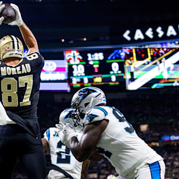 Sep 8, 2024; New Orleans, Louisiana, USA;  New Orleans Saints tight end Foster Moreau (87) scores a touchdown against the Carolina Panthers during the first half at Caesars Superdome. 