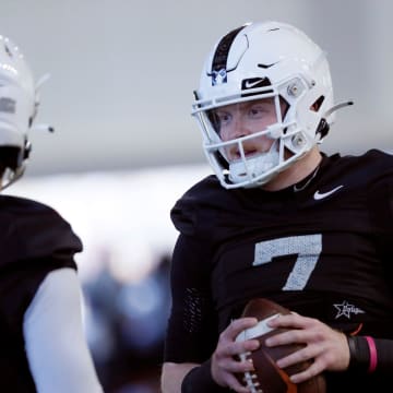 Oklahoma State's Alan Bowman talks with Garret Rangel during an Oklahoma State University Cowboys spring football practice in Stillwater, Okla., Tuesday, March 26, 2024.