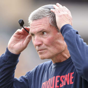 Sep 9, 2023; Morgantown, West Virginia, USA; Duquesne Dukes head coach Jerry Schmitt along the sidelines during the first quarter against the West Virginia Mountaineers at Mountaineer Field at Milan Puskar Stadium. Mandatory Credit: Ben Queen-Imagn Images