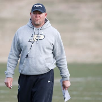 Purdue Boilermakers head coach Barry Odom looks down field 