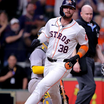 May 14, 2024; Houston, Texas, USA; Houston Astros pinch runner Trey Cabbage (38) crosses home plate to score the game-winning run against the Oakland Athletics during the tenth inning at Minute Maid Park.