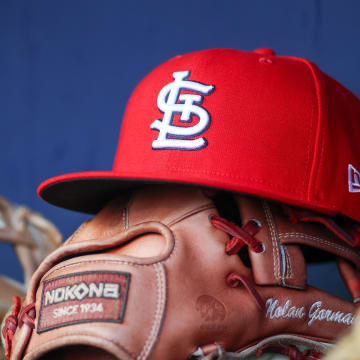 Sep 5, 2023; Atlanta, Georgia, USA; A detailed view of the hat and glove of St. Louis Cardinals second baseman Nolan Gorman (not pictured) before a game against the Atlanta Braves at Truist Park. Mandatory Credit: Brett Davis-USA TODAY Sports