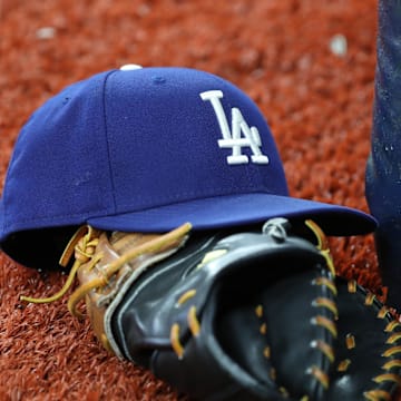 May 21, 2019; St. Petersburg, FL, USA; A detail view of Los Angeles Dodgers hat and glove at Tropicana Field. Mandatory Credit: Kim Klement-Imagn Images